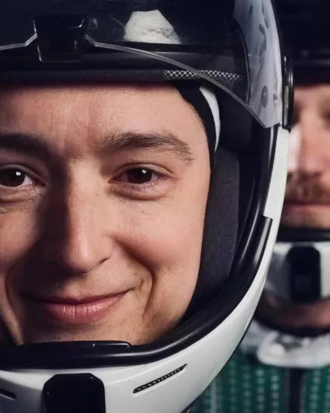 Two athletes in flight helmets
